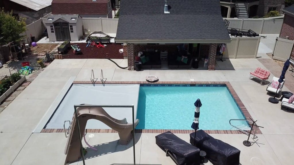 Aerial view of a professional pool cover installation